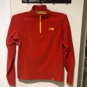 The North Face women’s size small red 1/4 zip fleece.